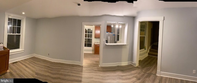 spare room featuring dark hardwood / wood-style flooring