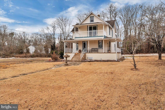 view of front of property with a front lawn and a porch