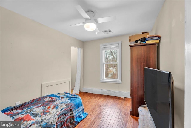 bedroom featuring wood-type flooring and ceiling fan