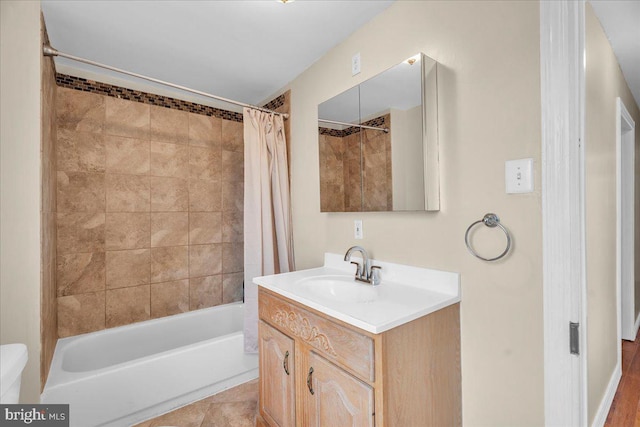 bathroom featuring shower / bathtub combination with curtain, tile patterned flooring, and vanity