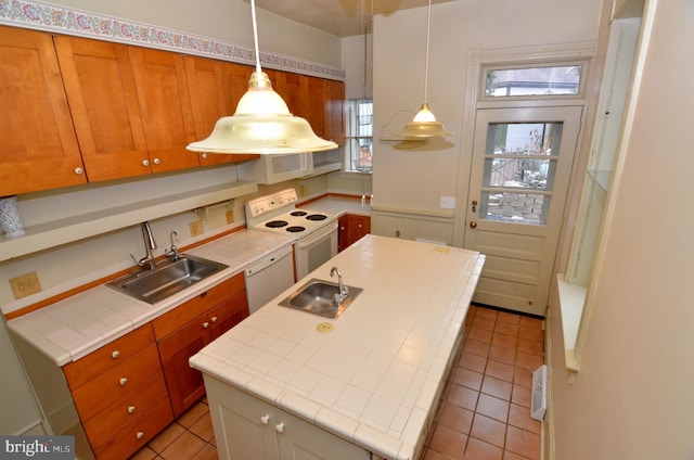 kitchen with white appliances, light tile patterned floors, and sink