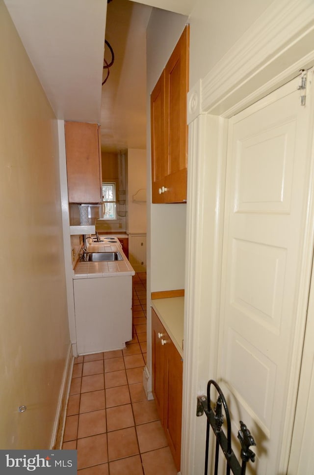 kitchen with sink and light tile patterned floors