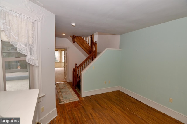 interior space with vaulted ceiling and hardwood / wood-style flooring