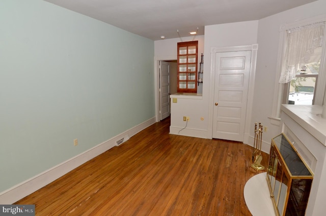 bedroom with hardwood / wood-style flooring