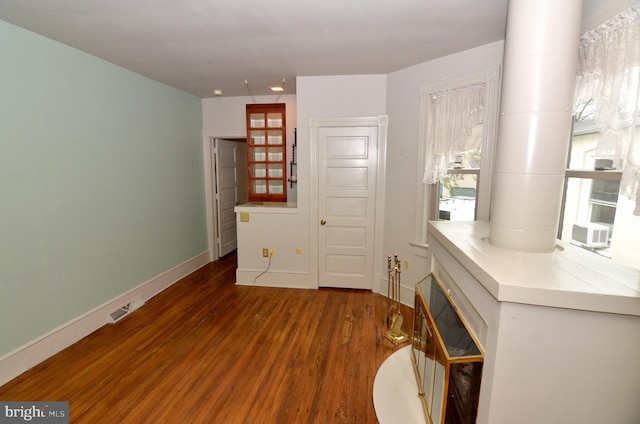 interior space with dark hardwood / wood-style flooring