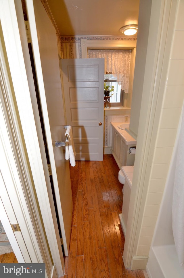 bathroom featuring hardwood / wood-style flooring