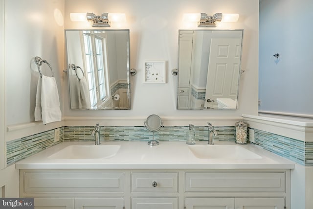 bathroom with backsplash and vanity