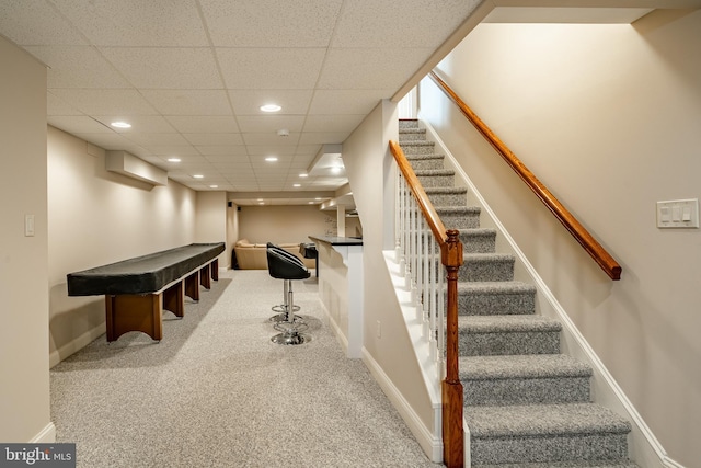 playroom featuring a drop ceiling and carpet