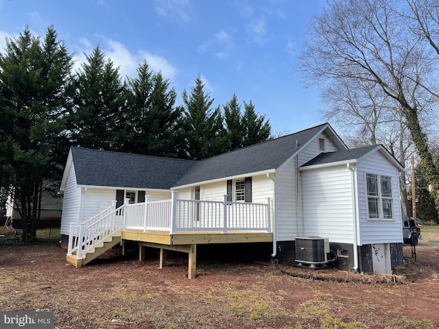 view of front facade with a deck and central AC