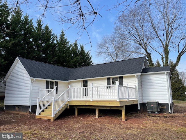 view of front of property with a deck and cooling unit