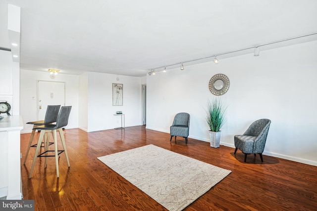 sitting room with hardwood / wood-style flooring