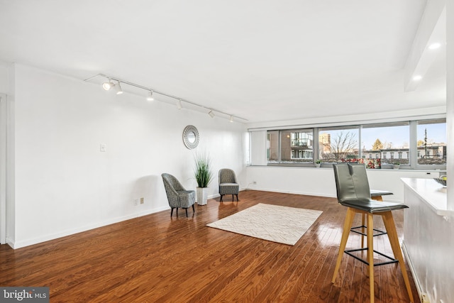 sitting room featuring dark hardwood / wood-style flooring