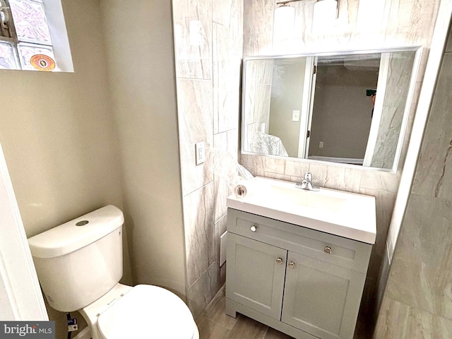 bathroom with vanity and toilet