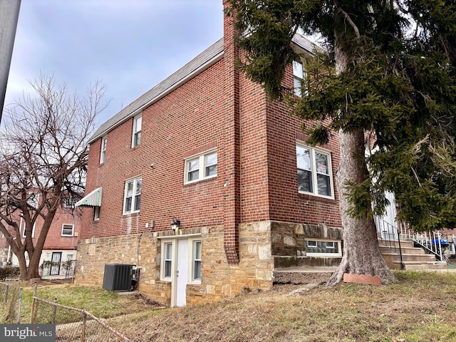 view of home's exterior with central AC unit