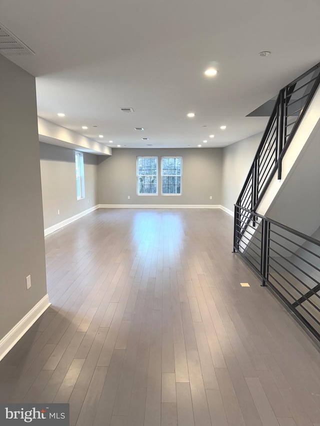 unfurnished living room with wood-type flooring