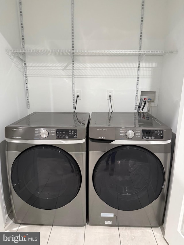 washroom with separate washer and dryer