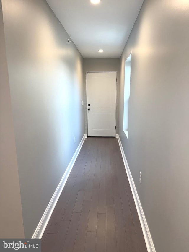 hallway featuring dark hardwood / wood-style flooring