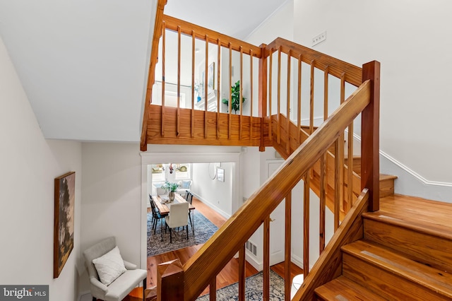 stairway with wood-type flooring