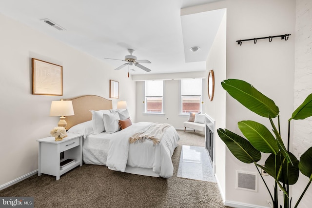 bedroom with ceiling fan and carpet flooring