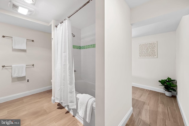 bathroom with shower / bath combination with curtain