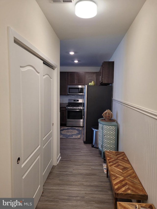 hall with dark hardwood / wood-style flooring