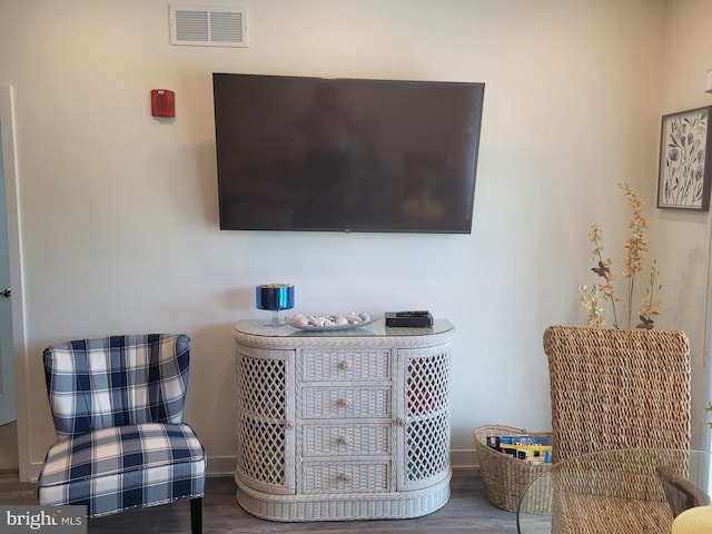 living area with hardwood / wood-style flooring