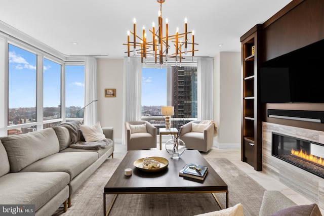 living room featuring an inviting chandelier and floor to ceiling windows