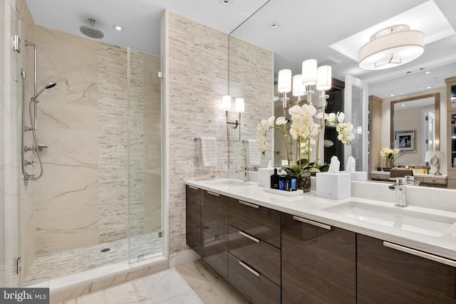 bathroom featuring vanity and a shower with shower door