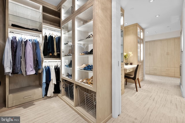 walk in closet with built in desk