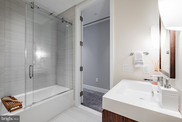 bathroom with tile patterned flooring, vanity, and enclosed tub / shower combo