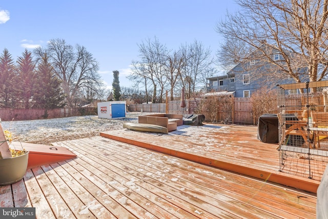 wooden terrace featuring a hot tub