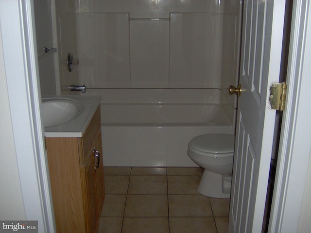 full bathroom with tile patterned flooring, vanity,  shower combination, and toilet