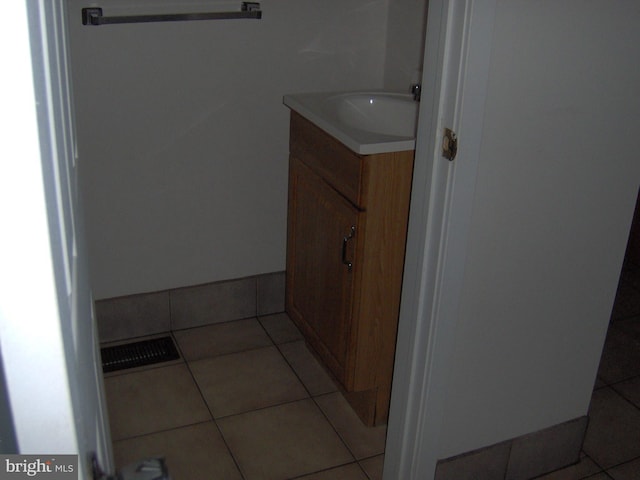 bathroom with tile patterned floors and vanity