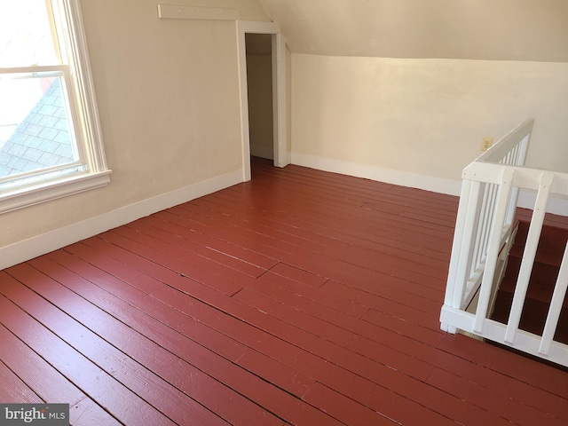 bonus room featuring wood-type flooring and lofted ceiling