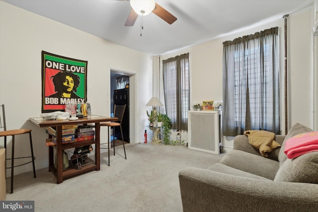 carpeted office with ceiling fan