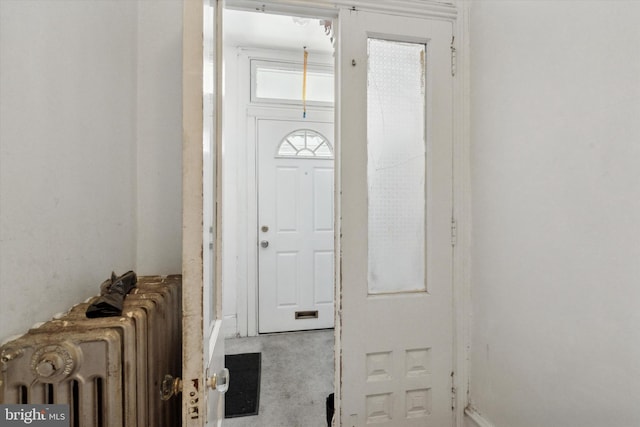 foyer entrance featuring radiator