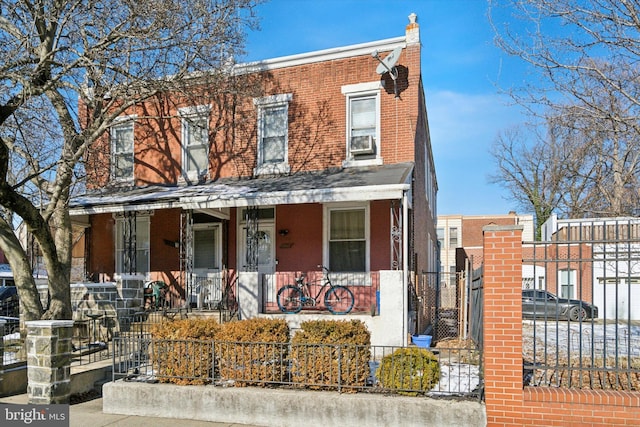 multi unit property with a porch and cooling unit