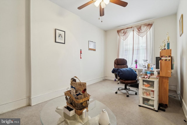 office area featuring ceiling fan and light colored carpet