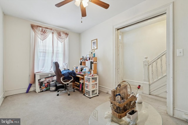 office featuring light carpet and ceiling fan