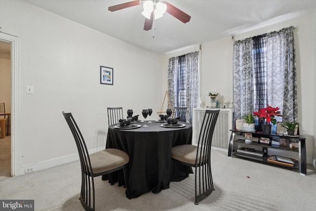 dining space featuring ceiling fan, carpet, and plenty of natural light