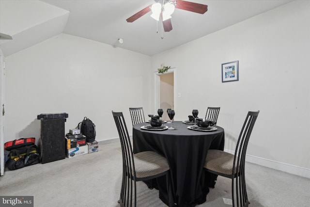 dining area with lofted ceiling, carpet flooring, and ceiling fan