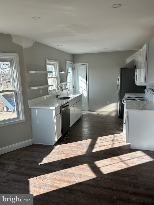 kitchen featuring sink, white cabinets, dark hardwood / wood-style floors, and white appliances