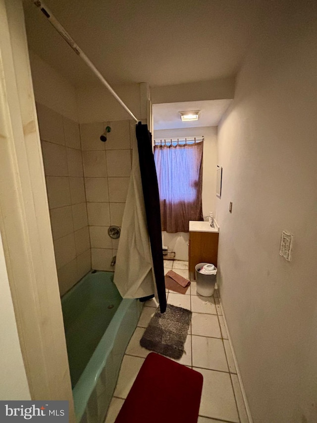 bathroom featuring tile patterned floors, sink, and walk in shower