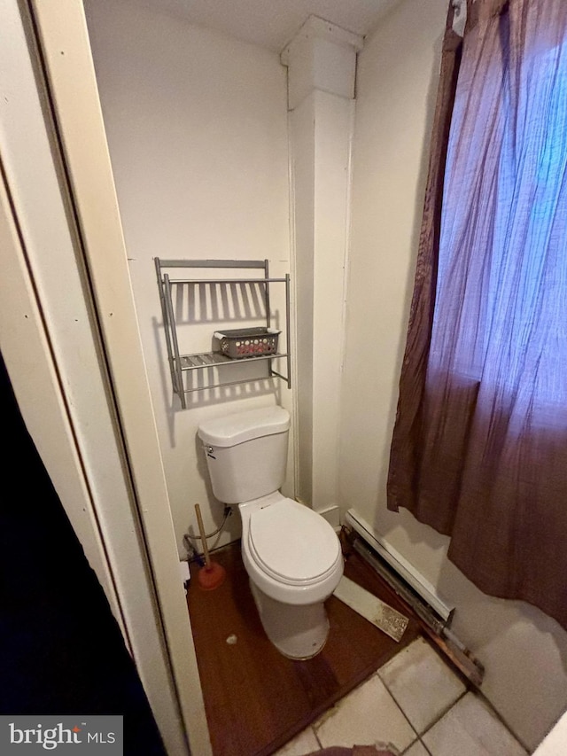 bathroom with tile patterned flooring and toilet