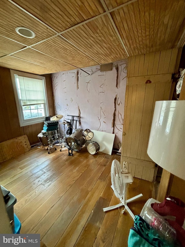 miscellaneous room with hardwood / wood-style flooring, wooden walls, and wood ceiling