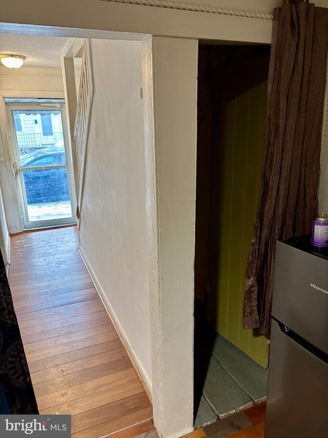 hallway featuring light hardwood / wood-style flooring