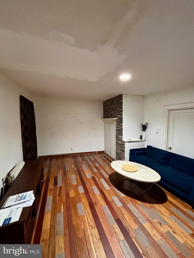 unfurnished living room with wood-type flooring