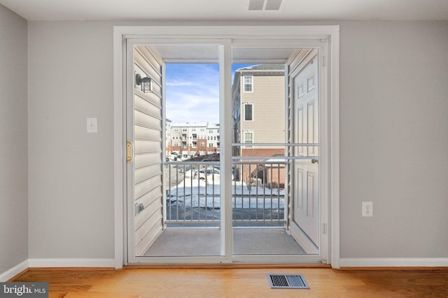 entryway with hardwood / wood-style floors and a wealth of natural light