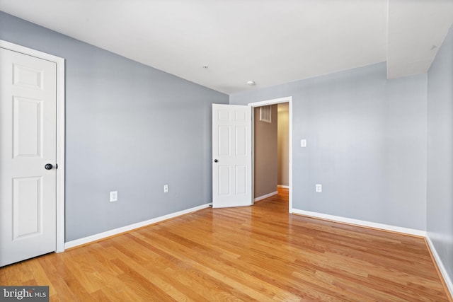 spare room with light wood-type flooring