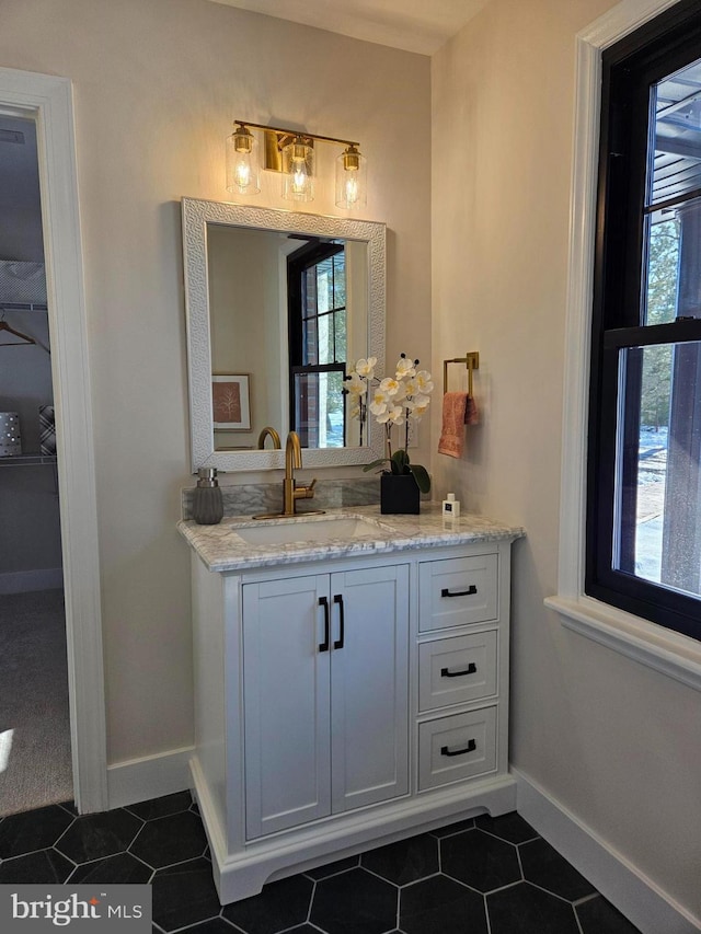 bathroom with tile patterned floors and vanity